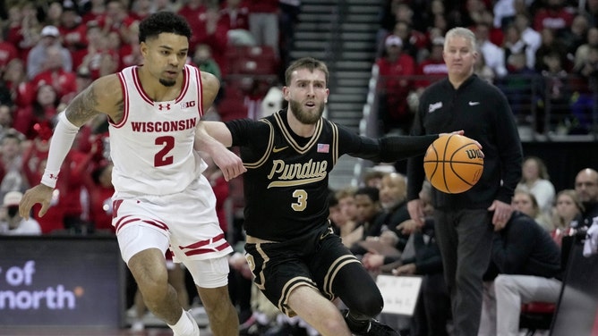 Purdue PG Braden Smith drives past Wisconsin guard Nick Boyd at the Kohl Center in Madison. (Photo credit: © Mark Hoffman/Milwaukee Journal Sentinel / USA TODAY NETWORK via Imagn Images) 