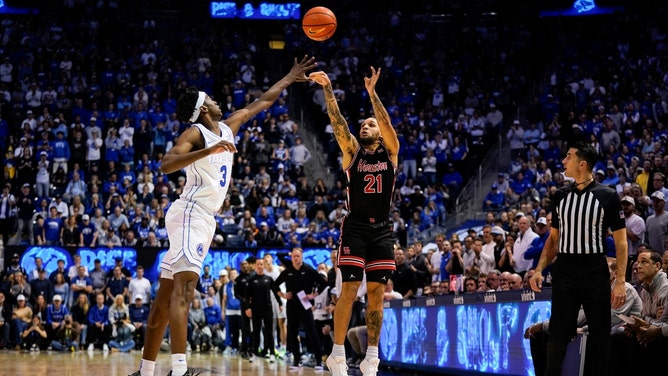 Houston Cougars guard Emanuel Sharp shoots over BYU Cougars wing AJ Dybantsa at Marriott Center in Provo, Utah. (Photo credit: Aaron Baker-Imagn Images)