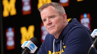 Michigan head coach Dusty May during a press conference ahead of the Final Four of the men's 2026 NCAA Tournament at Lucas Oil Stadium.