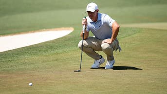 Rory McIlroy putting at Augusta National during the Masters
