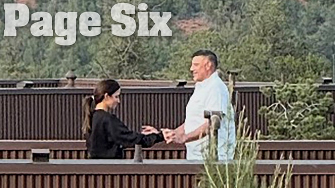 Dianna Russini holding hands with Mike Vrabel