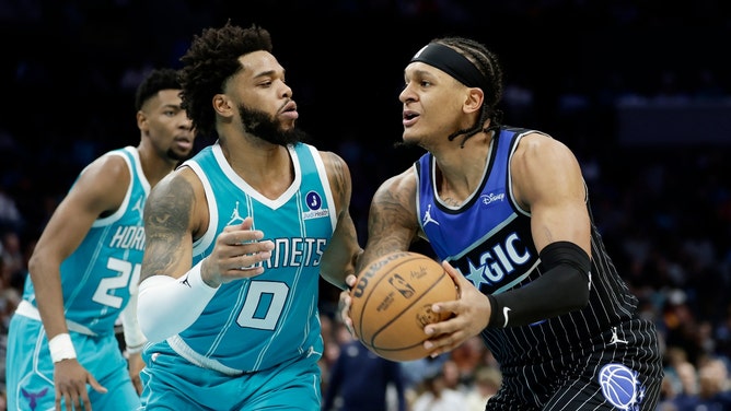 Orlando Magic forward Paolo Banchero drives to the basket on Charlotte Hornets forward Miles Bridges at Spectrum Center in North Carolina. (Photo Credit: Brian Westerholt-Imagn Images)